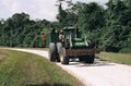 Katja and Augustas hitch a tractor in Belize.JPG